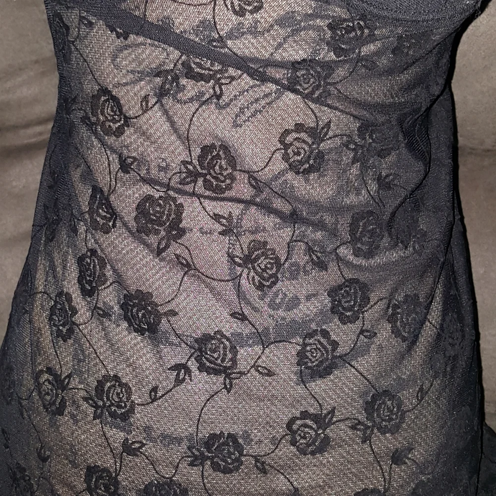 Black lingerie with‎ rose pattern